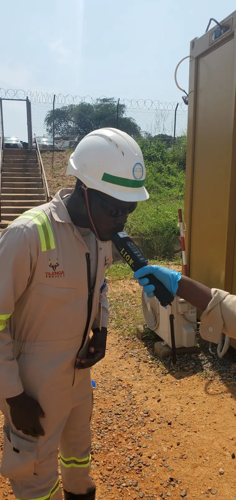 Worker being breathalysed at a site entry point